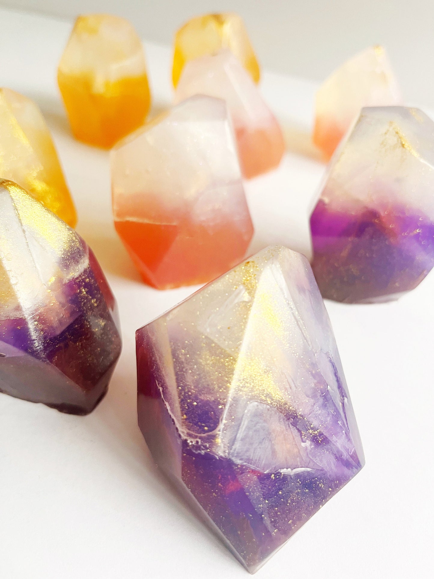 Colorful geometric soap bars on a white background