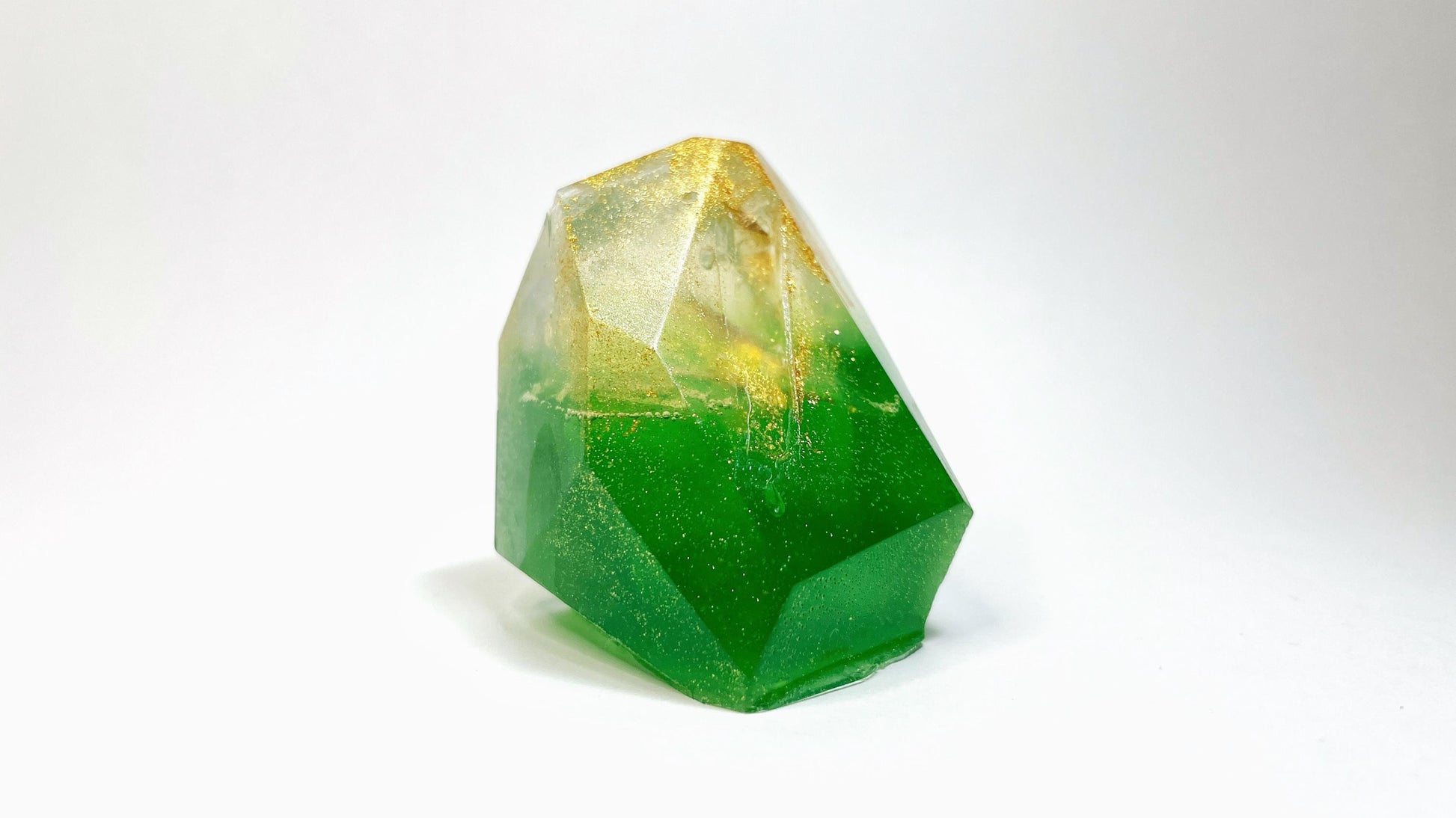 Green with gold sparkle geometric soap bar on a white background