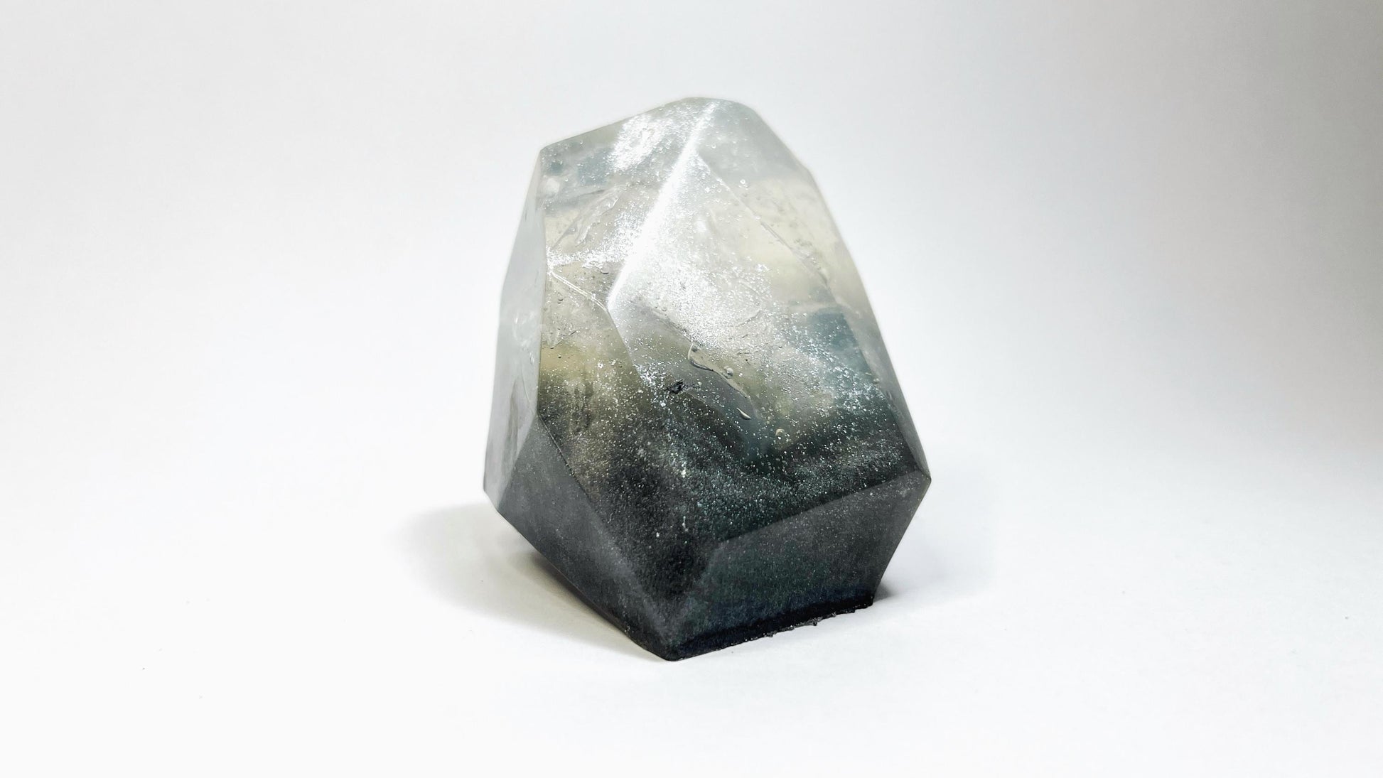 Faceted crystal gem shaped soap on a white background
