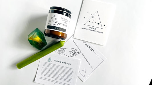 8oz Amber jar zodiac candle, taper candle, gem shaped soap, zodiac affirmation cards, and zodiac birthday card on a white surface